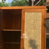 Detail pintu lemari rotan alami dengan finishing kayu jati natural